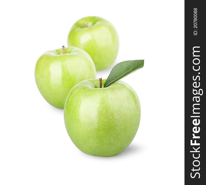 Group of green apples with a leaf. Isolated on a white background