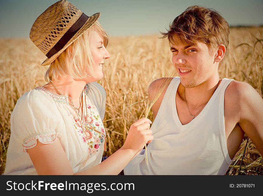 Image Of Young Man And Woman On Wheat Field