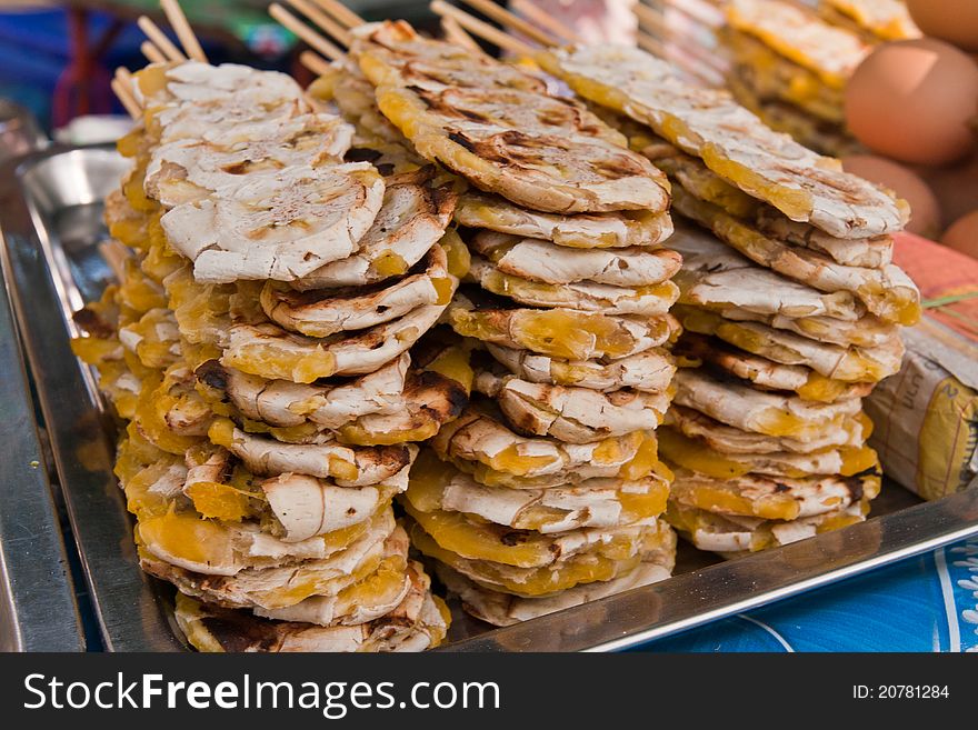 Pile of grilled bananas stack with wooden sticks