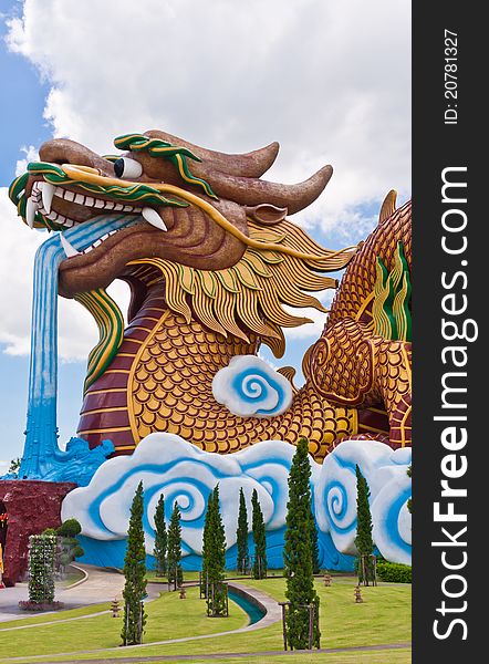 Golden dragon statue with blue sky vertical. Golden dragon statue with blue sky vertical