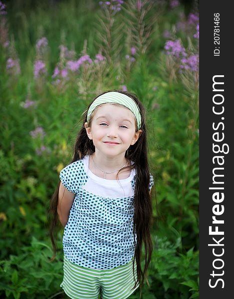 Outdoors portrait of adorable amazed child girl