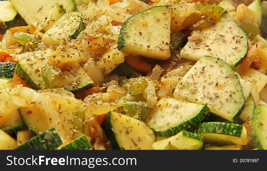 Baked zucchini vegetables and spices, close-up. Baked zucchini vegetables and spices, close-up