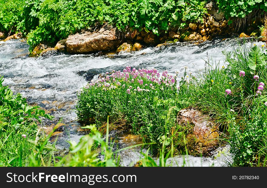 Summer landscape with green grass, mountains and river. Summer landscape with green grass, mountains and river