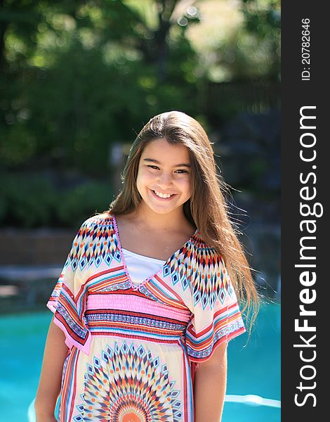 Cute Smiling Girl Outdoors By The Pool