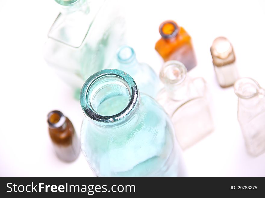 Vintage glass bottles on white