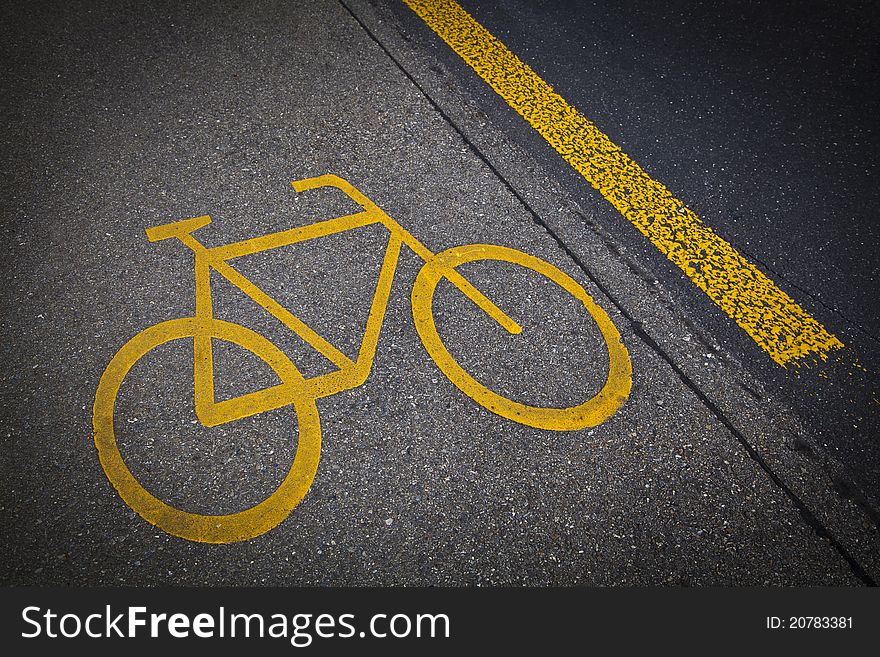 Bicycle road mark in a grey asphalt