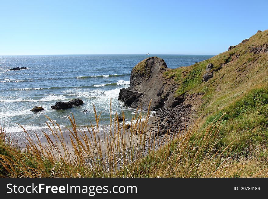 A beach surf and vegetation on the Oregon coastline. A beach surf and vegetation on the Oregon coastline.
