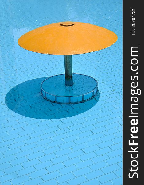 Small sunshade in swimming pool, shown as intersting color comparing and shape composition. Small sunshade in swimming pool, shown as intersting color comparing and shape composition.