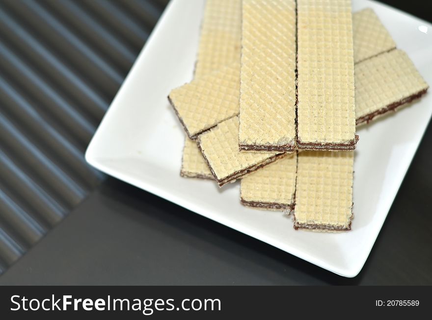 Top view of chocolate wafers placed on a plate. Top view of chocolate wafers placed on a plate.