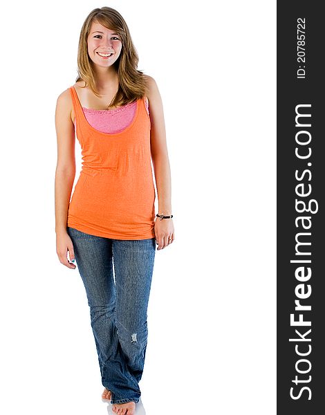 Seventeen year old girl poses wearing tank top with jeans. Seventeen year old girl poses wearing tank top with jeans.