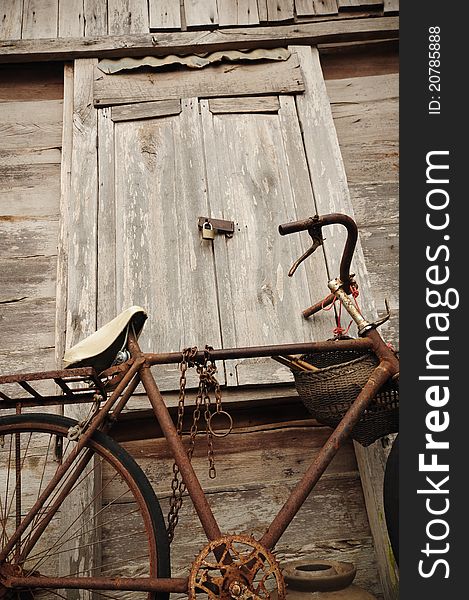 Image of Old Bicycle and old wood house