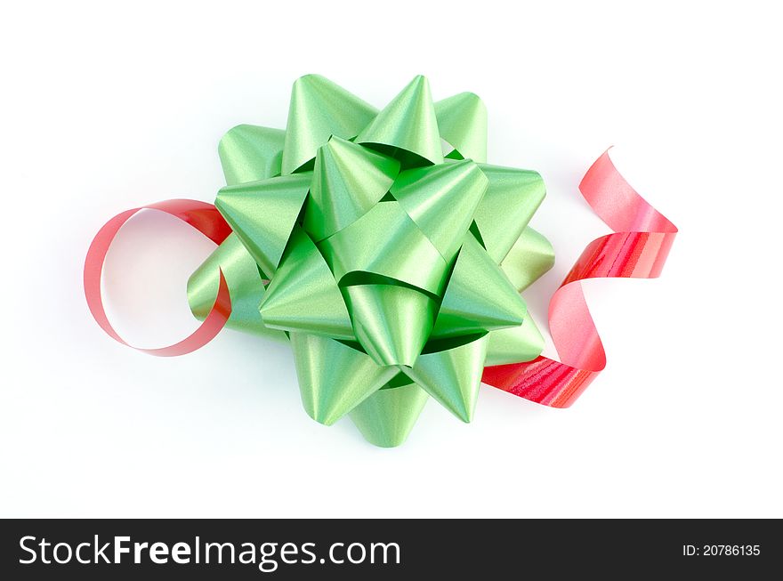 Green bow with red ribbon isolated on white. Green bow with red ribbon isolated on white