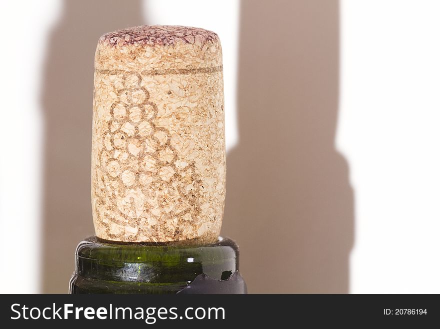 The red wine and the cork on focus. The red wine and the cork on focus