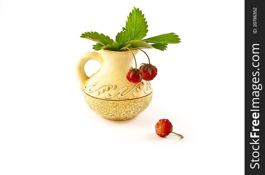 Strawberries in a small vase on a white background. Strawberries in a small vase on a white background