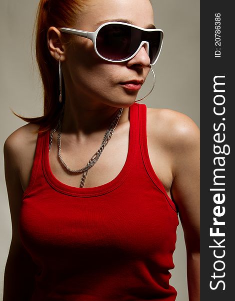 Portrait of funky white rapper chick in sunglasses. Portrait of funky white rapper chick in sunglasses