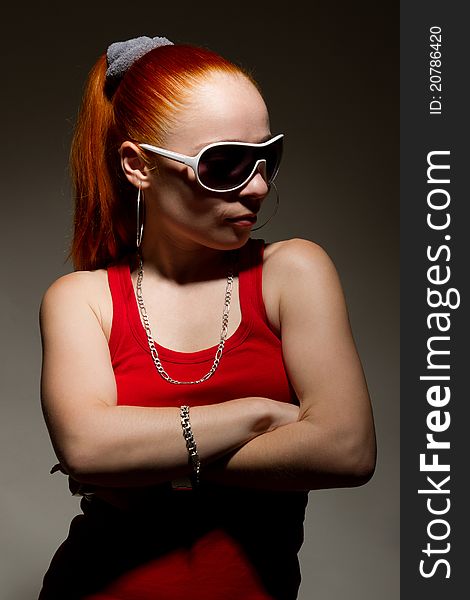 Portrait of funky white rapper chick in sunglasses. Portrait of funky white rapper chick in sunglasses