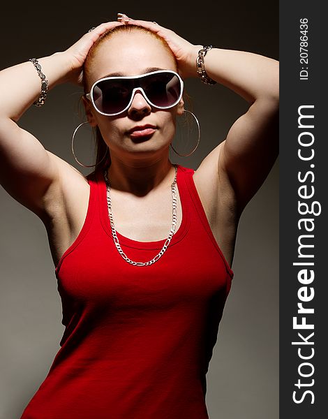 Portrait of funky white rapper chick in sunglasses. Portrait of funky white rapper chick in sunglasses