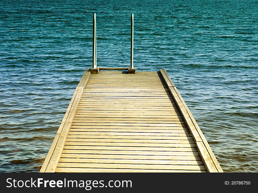 Swim platform with ladder against Baltic sea in the background. Swim platform with ladder against Baltic sea in the background