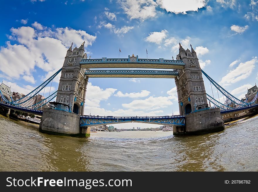 Famous tower bridge in London on warm sunny English afternoon shoot from the middle of the river.
