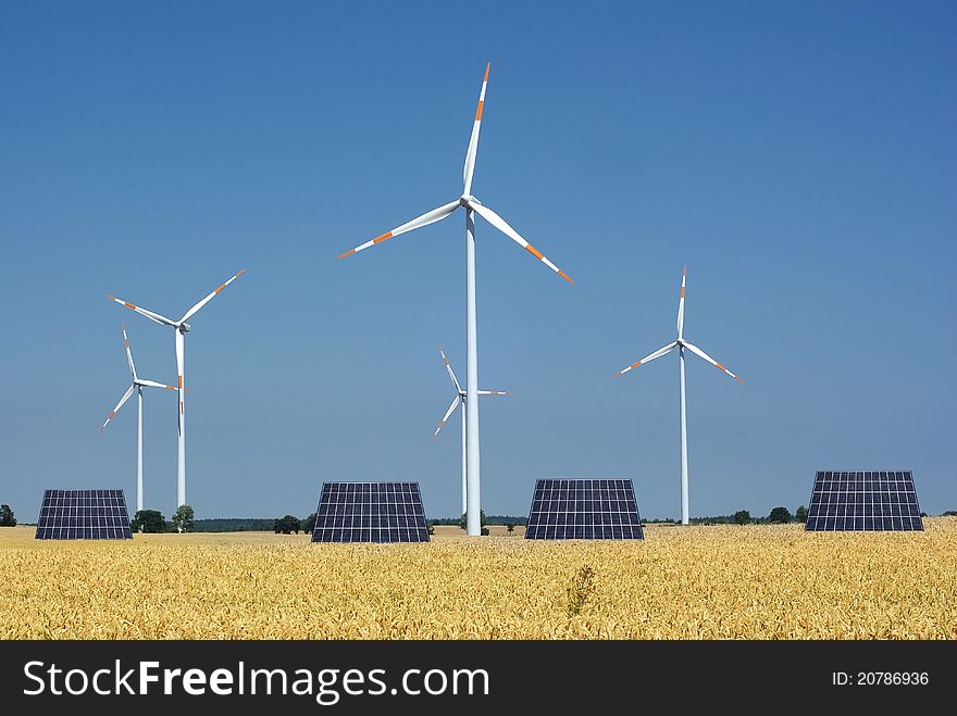 Wind turbine and sunny batteries on blue sky background