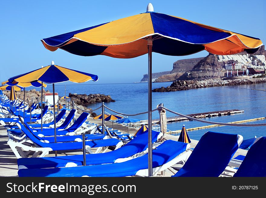 Deck Chairs And Umbrellas