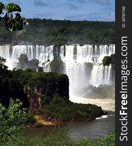 IguazÃº Falls, lie on the Argentina - Brazil border and are a UNESCO World Natural Heritage Site. IguazÃº Falls, lie on the Argentina - Brazil border and are a UNESCO World Natural Heritage Site.