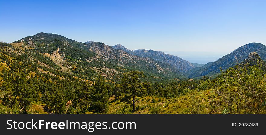 Among mountains with a view of the sea with clear blue sky. Among mountains with a view of the sea with clear blue sky