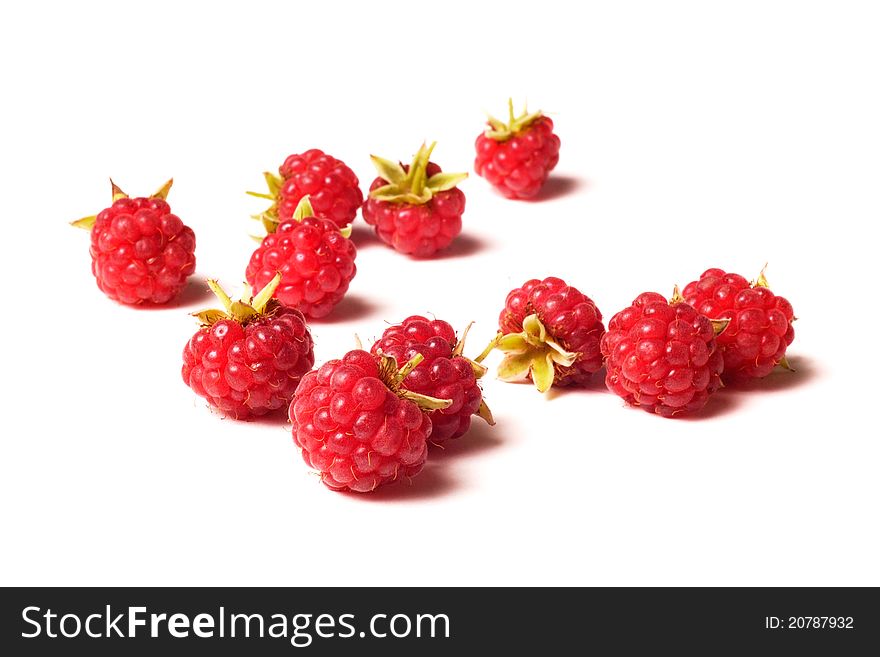 A lot of raspberry on white background. A lot of raspberry on white background