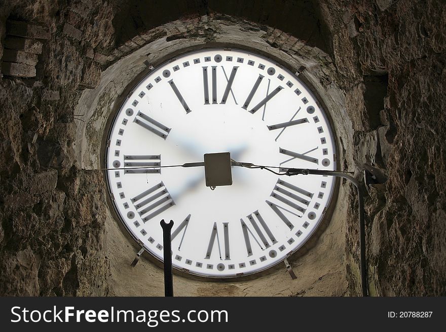 Backside of an old church clock in massa marittima, italy