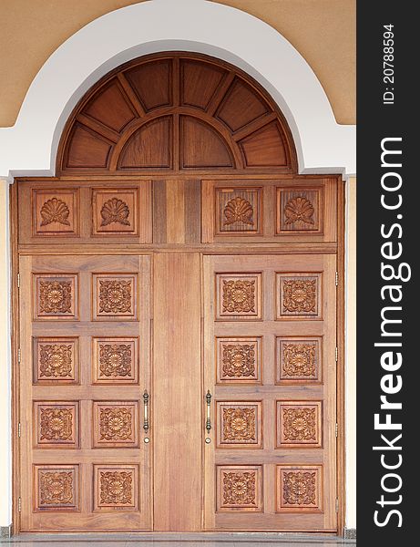 Old-fashioned big carved wooden door. Old-fashioned big carved wooden door