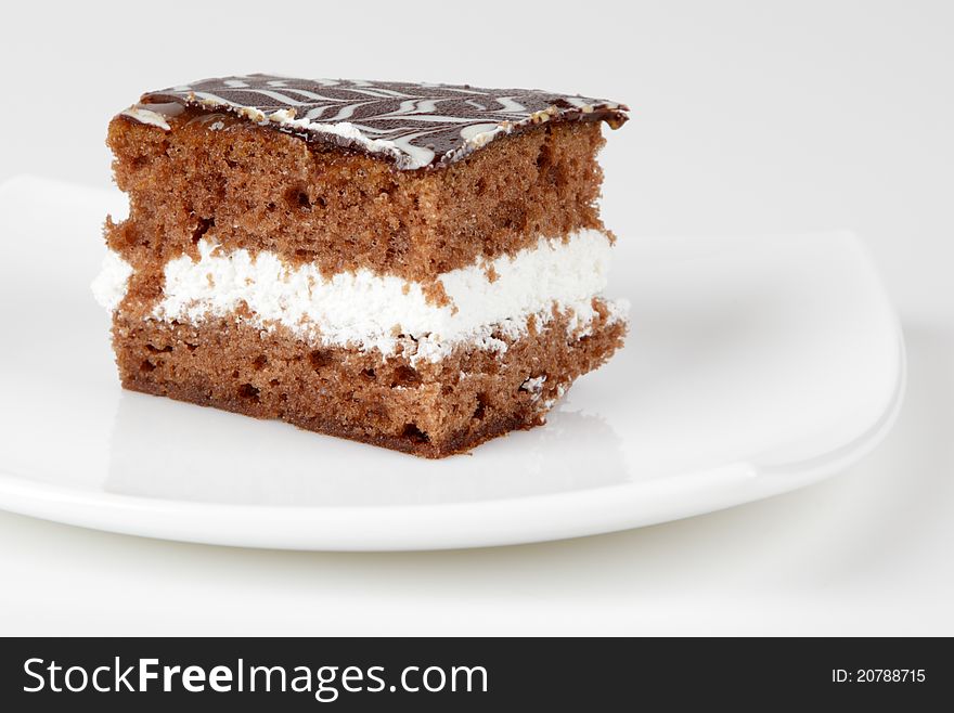 Cake on a plate on a white background.