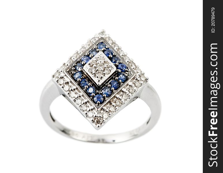 Close -up of diamond ring having many blue gem over white background