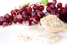 Oat Flakes And Grapes Royalty Free Stock Images