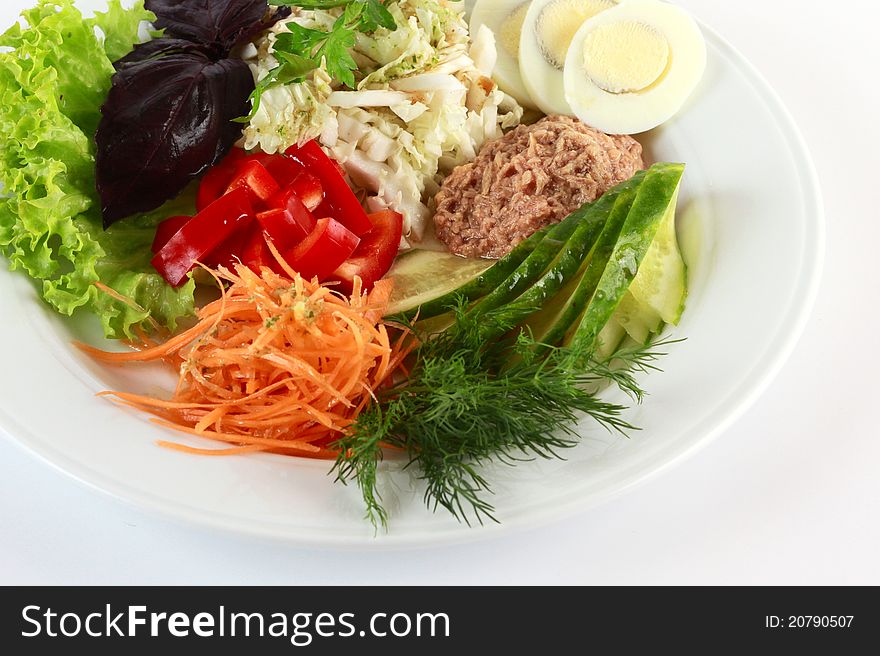 Vegetable salad with tuna, cucumber and sweet pepper