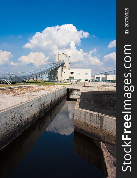 The water flowing from the concrete canal to the waste water treatment systems