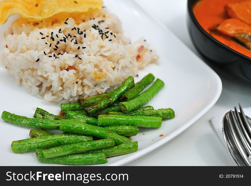 Healthy unpolished rice and lightly cooked green beans. Healthy unpolished rice and lightly cooked green beans.