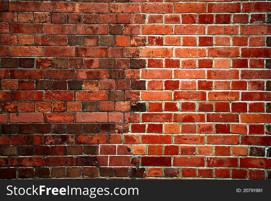 Weathered stained old brick wall background