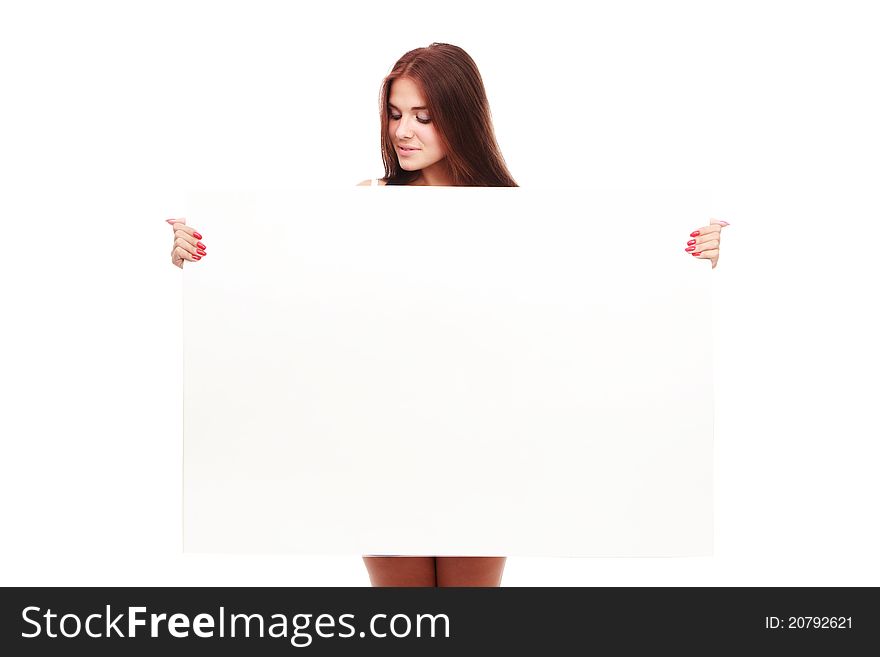 Portrait of a beautiful woman holding a blank billboard, looking out from behind it.