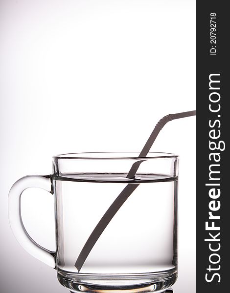 A glass cup with white background.