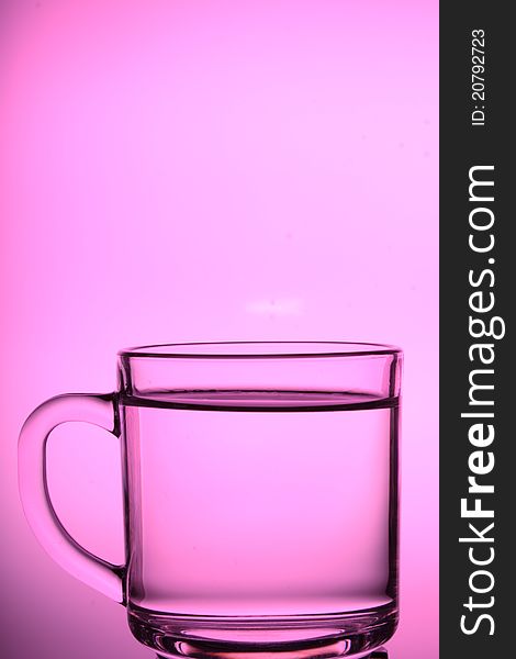 A glass cup with white background.
