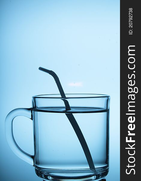 A glass cup with white background.