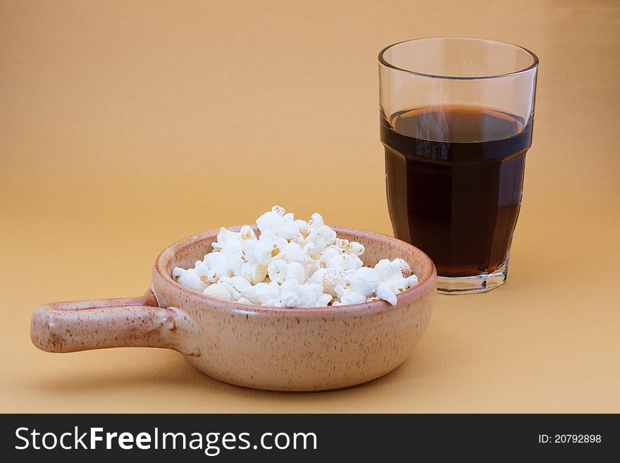 Bowl of pop corn and cola. Bowl of pop corn and cola