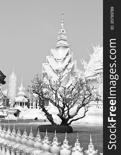 White temple and died tree