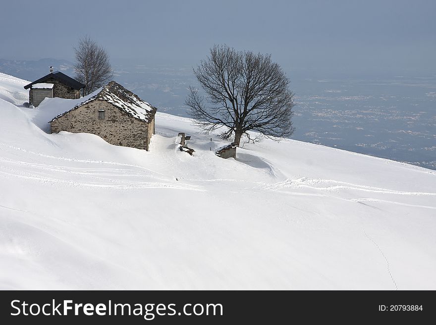 Mountain cabin in the snow in the Alps