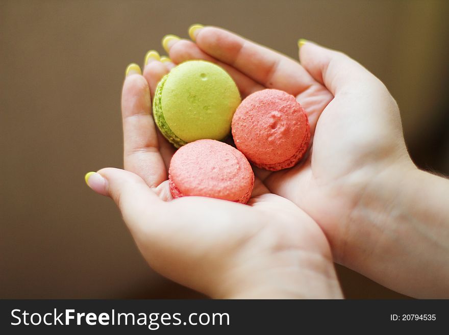 Multi Colored macaroon in the hands