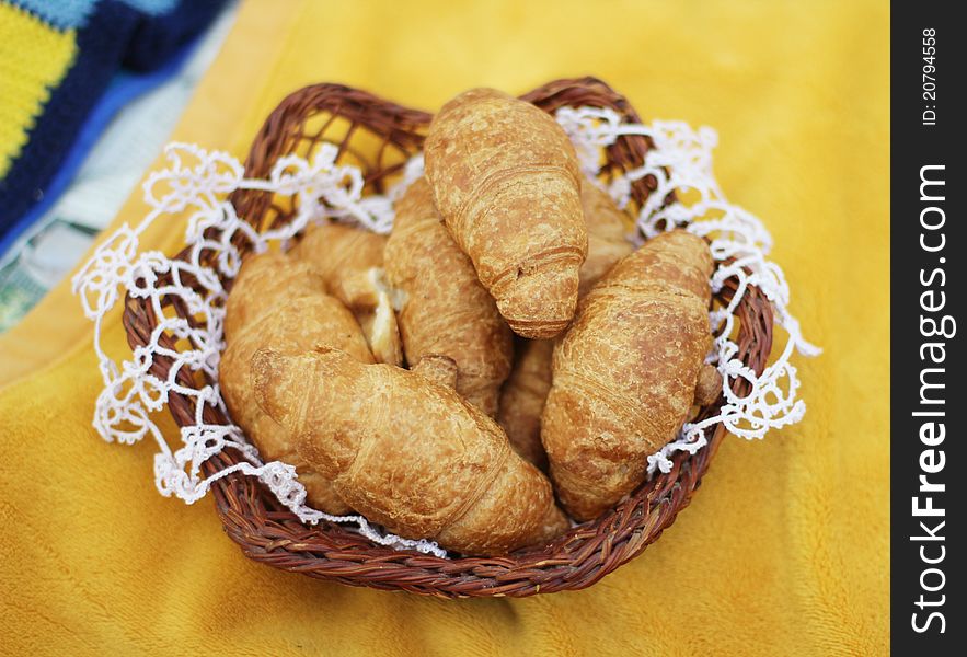 Croissants in a wicker tray