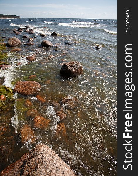 Seaside with rocks waves and blue sky, clean water with fresh clean water and soft wind. Seaside with rocks waves and blue sky, clean water with fresh clean water and soft wind