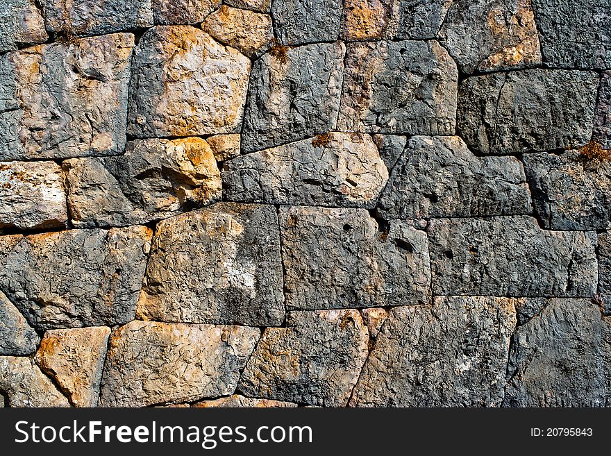 Fragment of wall made of wild stone. Fragment of wall made of wild stone