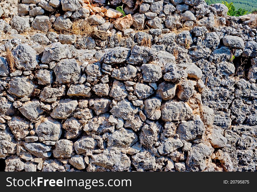 Fragment of wall made of wild stone. Fragment of wall made of wild stone