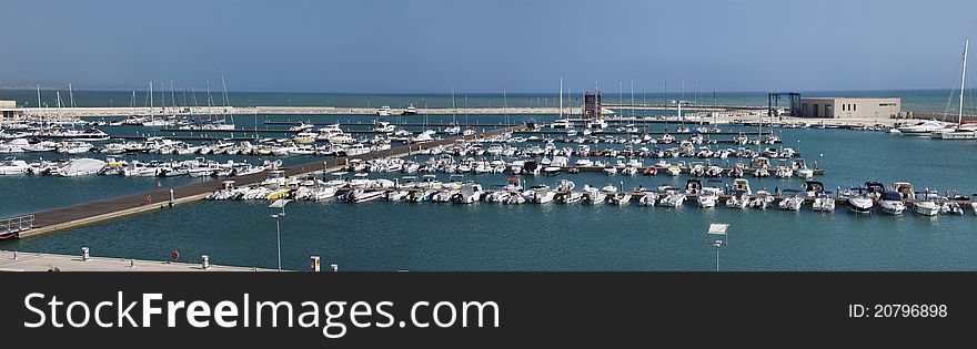 Italy, Siciliy, Mediterranean sea, Marina di Ragusa, panoramic view of boats in the marina